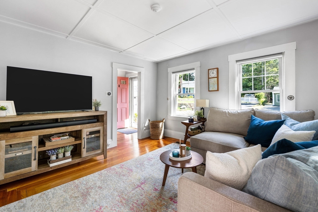 80 Washington Street Stoneham, MA 02180 - Photo 8 of 21 a living room with furniture and a flat screen tv