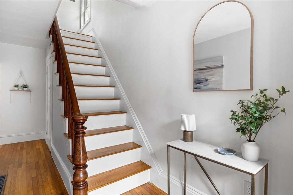 80 Washington Street Stoneham, MA 02180 - Photo 9 of 21 a view of entryway with wooden floor