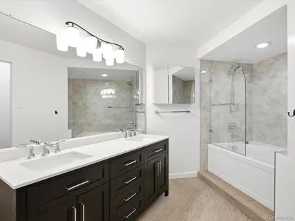 a bathroom with a bathtub and a shower