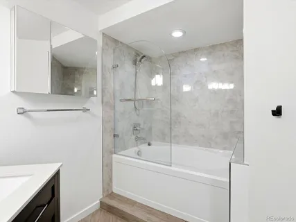 a view of an empty room with a closet