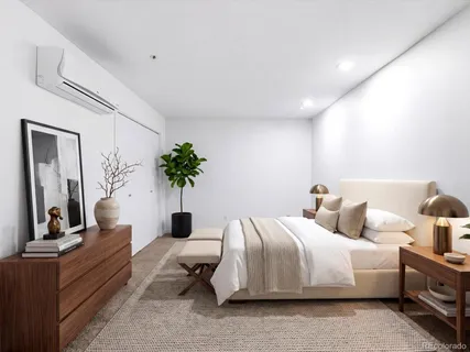 a bathroom with a bathtub shower sink vanity mirror and toilet