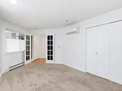 a living room with furniture and windows