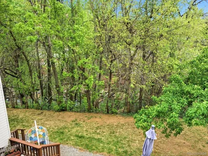 a view of house with outdoor seating area