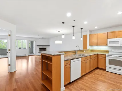 a bedroom with a large bed and a potted plant