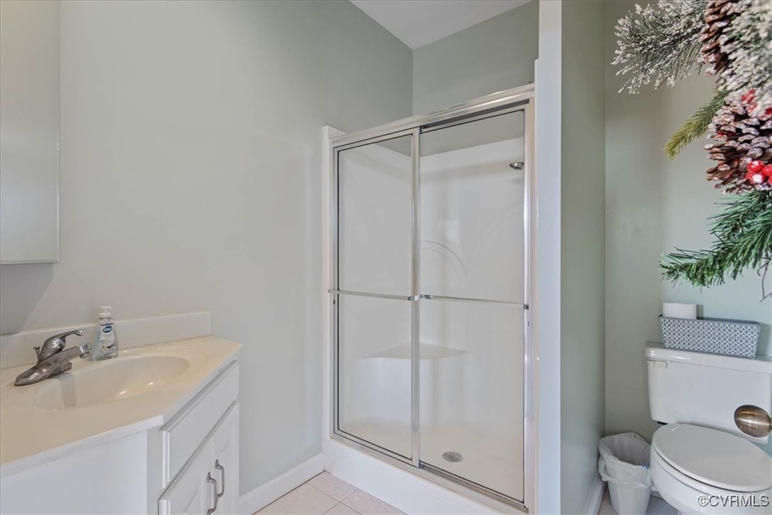 3008 New Design Road Dendron, VA 23839 - Photo 12 of 46 a bathroom with a granite countertop sink toilet and shower