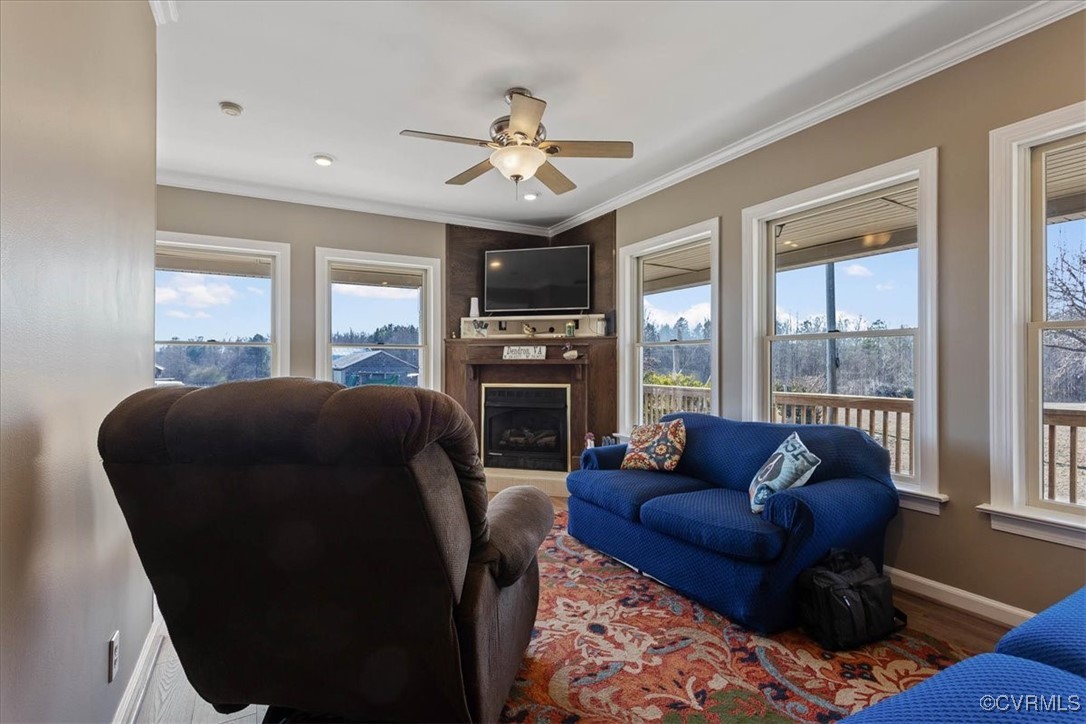 3008 New Design Road Dendron, VA 23839 - Photo 15 of 46 a living room with furniture and a large window