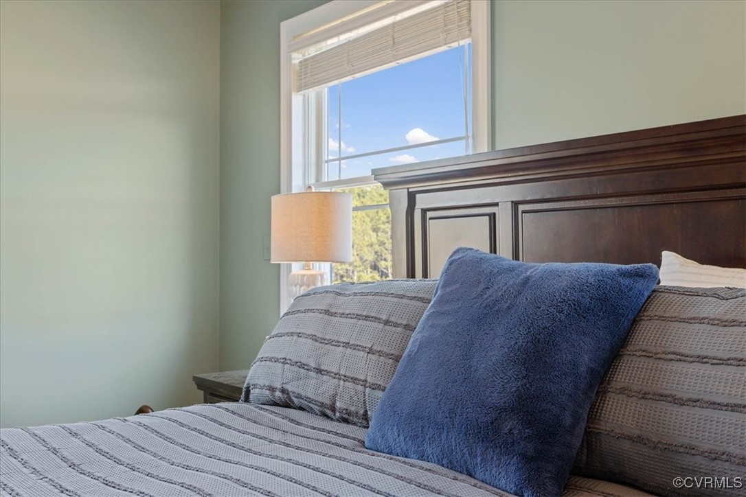 3008 New Design Road Dendron, VA 23839 - Photo 20 of 46 a bedroom with a bed and a window