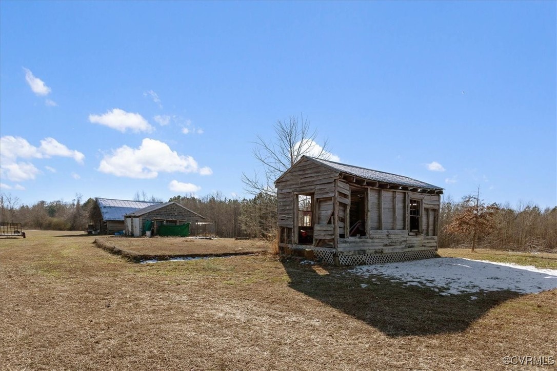 3008 New Design Road Dendron, VA 23839 - Photo 31 of 46 a front view of a house with a yard