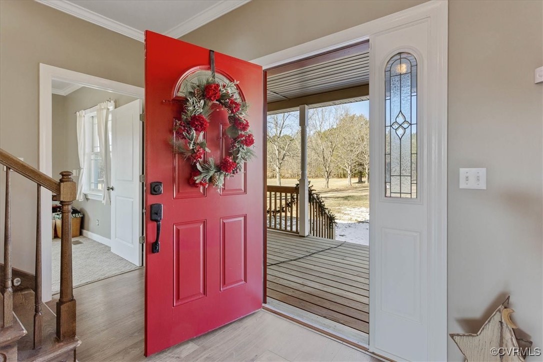 3008 New Design Road Dendron, VA 23839 - Photo 4 of 46 a view of a hallway with wooden floor and windows