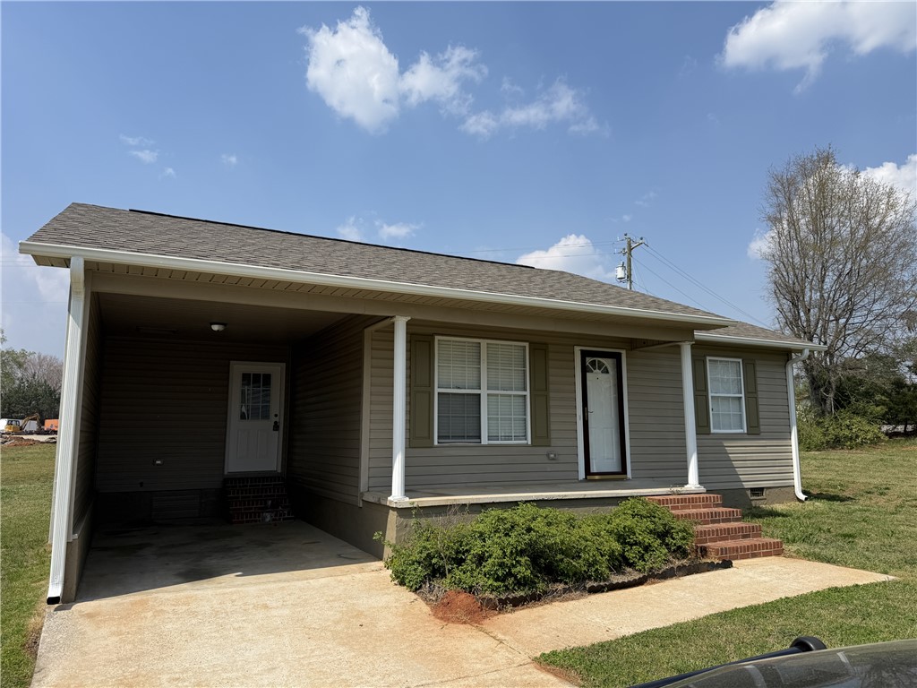 This charming home offers convenient parking and classic architectural elements.