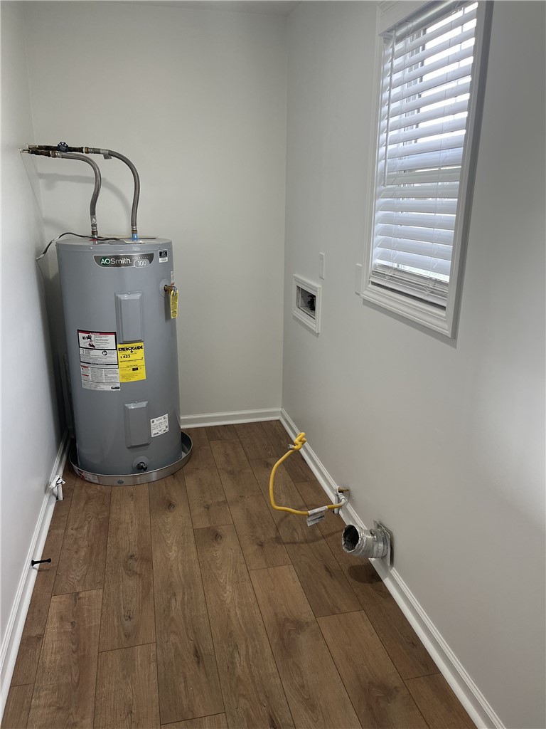 317 Dixie Drive Seneca, SC 29672 - Photo 2 of 7 This laundry area features durable flooring and essential utilities.