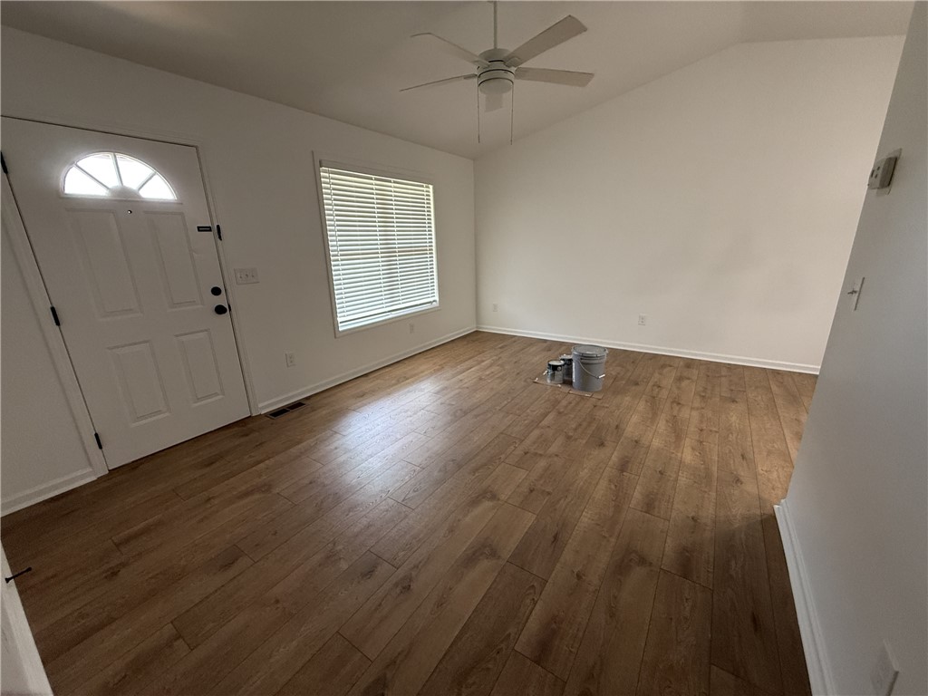 317 Dixie Drive Seneca, SC 29672 - Photo 5 of 7 This bright room features a vaulted ceiling, durable laminate flooring, and abundant natural light.