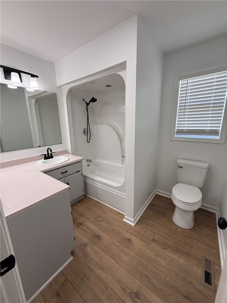 317 Dixie Drive Seneca, SC 29672 - Photo 6 of 7 This updated bathroom offers both comfort and functionality with a combined tub and shower.