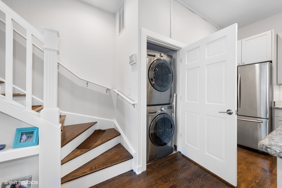 908 North Howe Street Chicago, IL 60610 - Photo 12 of 25 a view of a hallway with washer and dryer