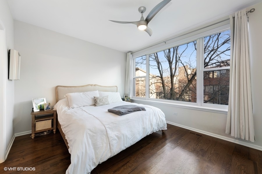 908 North Howe Street Chicago, IL 60610 - Photo 13 of 25 a bedroom with a bed and a large window