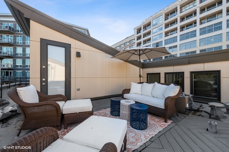 908 North Howe Street Chicago, IL 60610 - Photo 24 of 25 a view of a patio with couches and potted plants