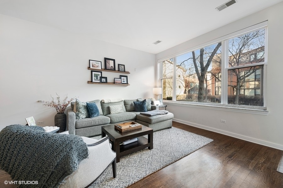 908 North Howe Street Chicago, IL 60610 - Photo 3 of 25 a living room with furniture and a large window