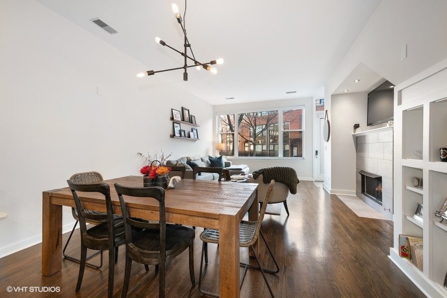 908 North Howe Street Chicago, IL 60610 - Photo 6 of 25 a view of a dining room with furniture and wooden floor
