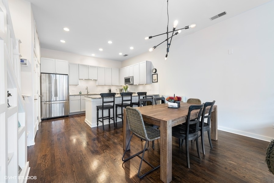 908 North Howe Street Chicago, IL 60610 - Photo 8 of 25 a view of a dining room with furniture and wooden floor