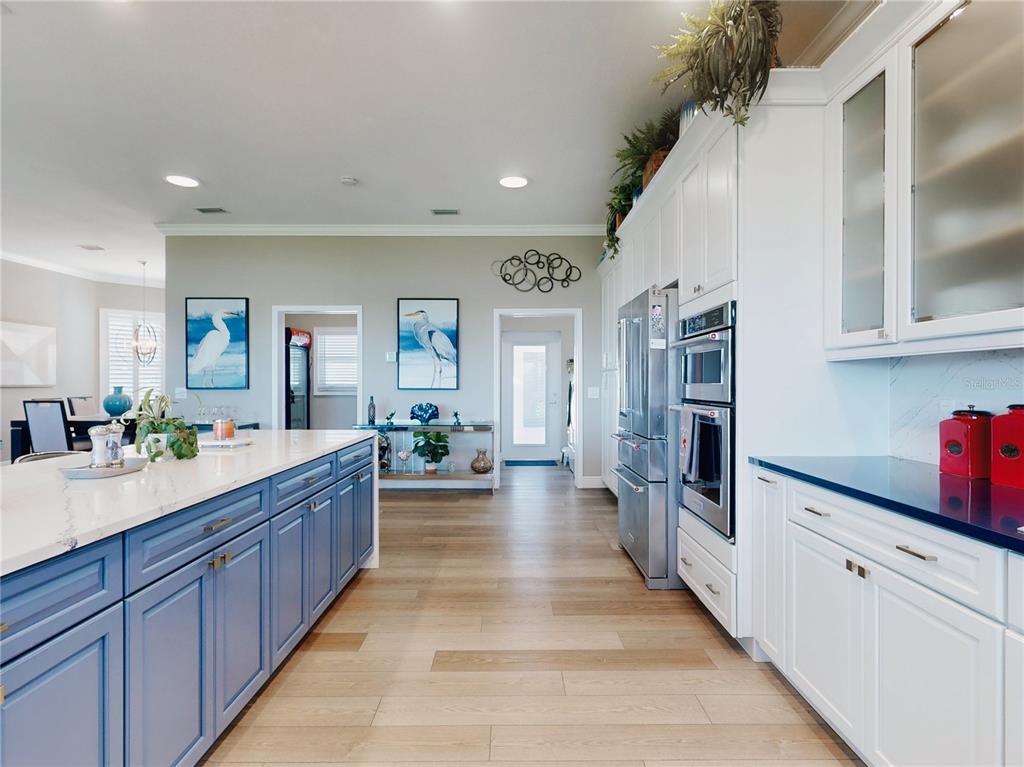 2019 South Riverside Drive Edgewater, FL 32141 - Photo 13 of 94 a large kitchen with stainless steel appliances lots of counter space and wooden floor