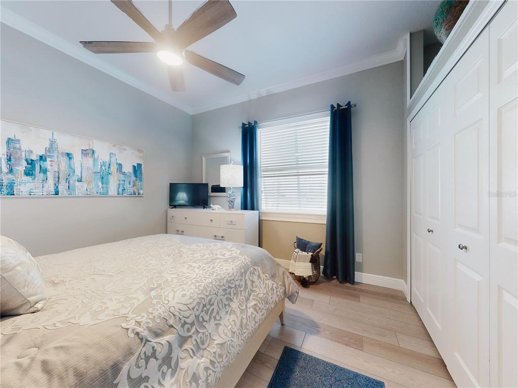 2019 South Riverside Drive Edgewater, FL 32141 - Photo 27 of 94 a bedroom with a large bed and a window