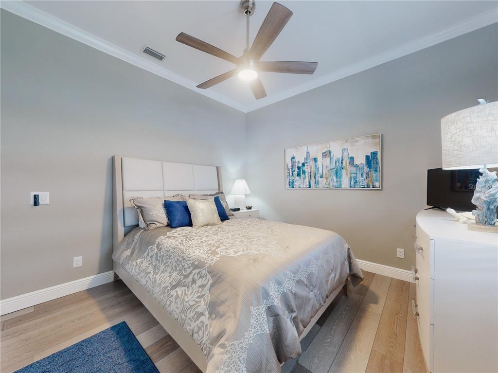 2019 South Riverside Drive Edgewater, FL 32141 - Photo 28 of 94 a bedroom with a bed and a desk