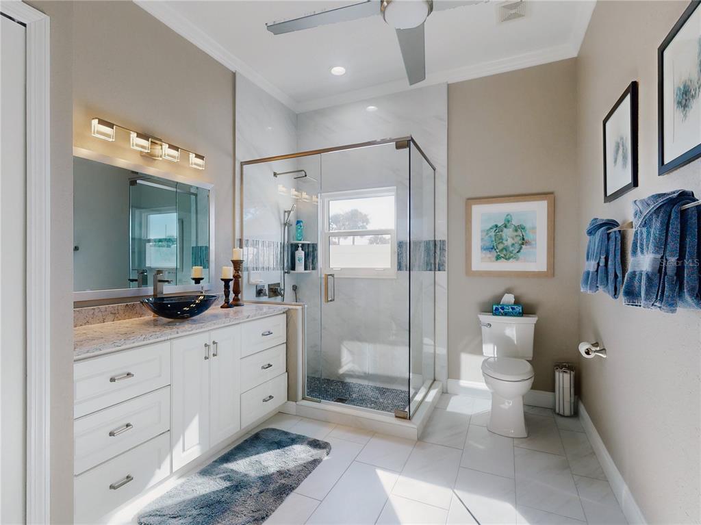 2019 South Riverside Drive Edgewater, FL 32141 - Photo 29 of 94 a bathroom with a double vanity sink toilet and shower