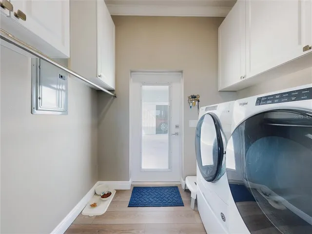 a bathroom with a granite countertop sink and a bathtub