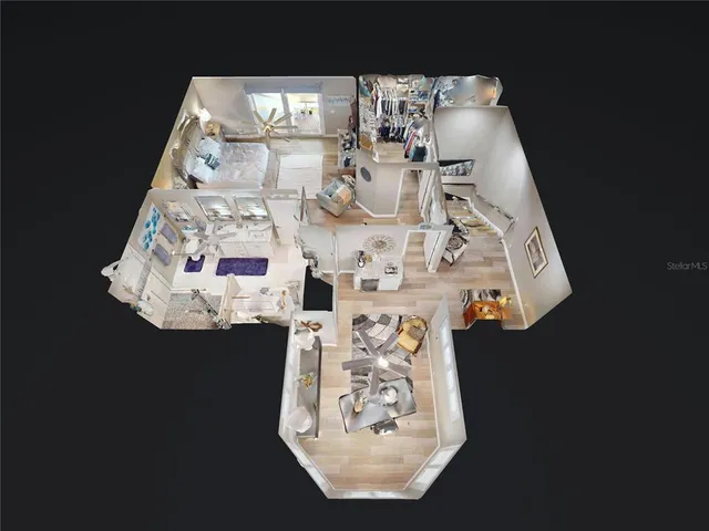 an aerial view of a house with a garden and lake view