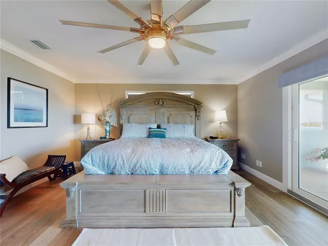 a aerial view of a house with a yard table and chairs