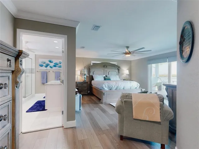 a view of a lake with a table and chairs