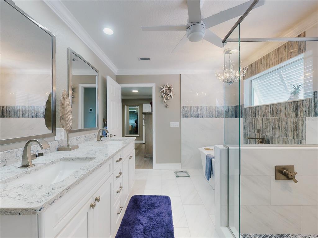 2019 South Riverside Drive Edgewater, FL 32141 - Photo 46 of 94 a bathroom with a double vanity sink and mirror