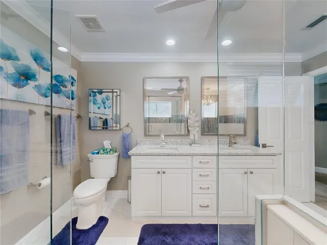 a view of a house with a yard table and chairs