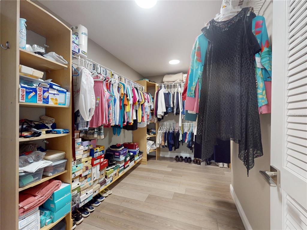 2019 South Riverside Drive Edgewater, FL 32141 - Photo 48 of 94 a view of walk in closet with clothes