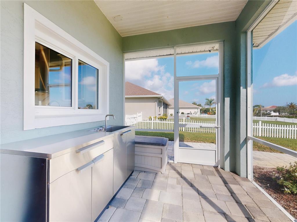 2019 South Riverside Drive Edgewater, FL 32141 - Photo 51 of 94 a bathroom with a granite countertop sink and a bathtub