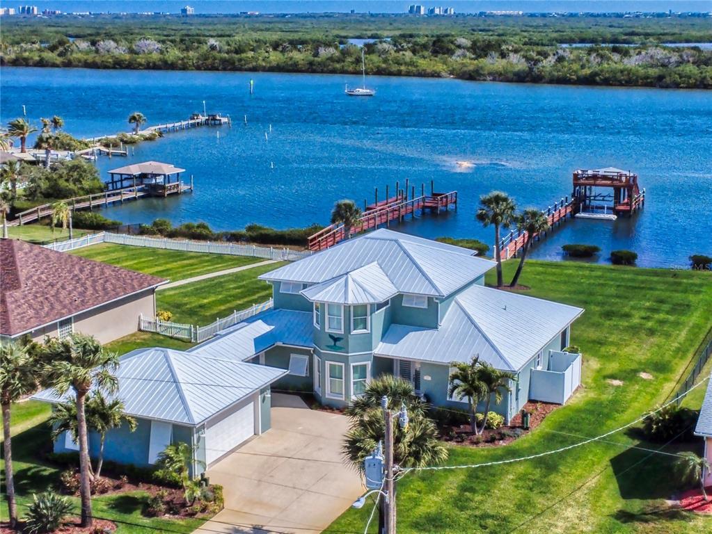 2019 South Riverside Drive Edgewater, FL 32141 - Photo 58 of 94 an aerial view of a house with a garden and lake view
