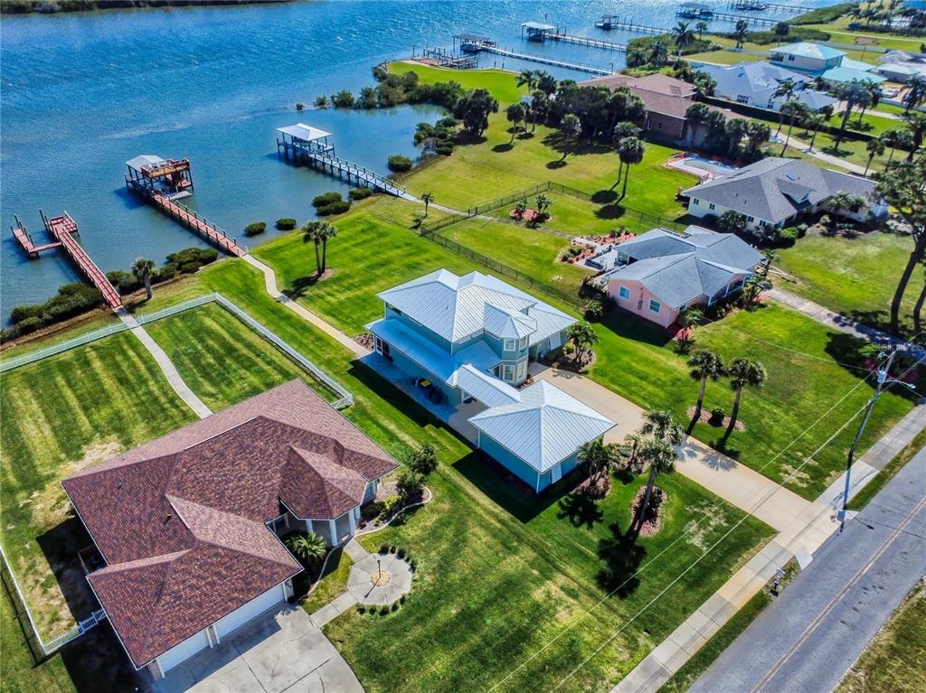 2019 South Riverside Drive Edgewater, FL 32141 - Photo 61 of 94 an aerial view of a house a garden and swimming pool