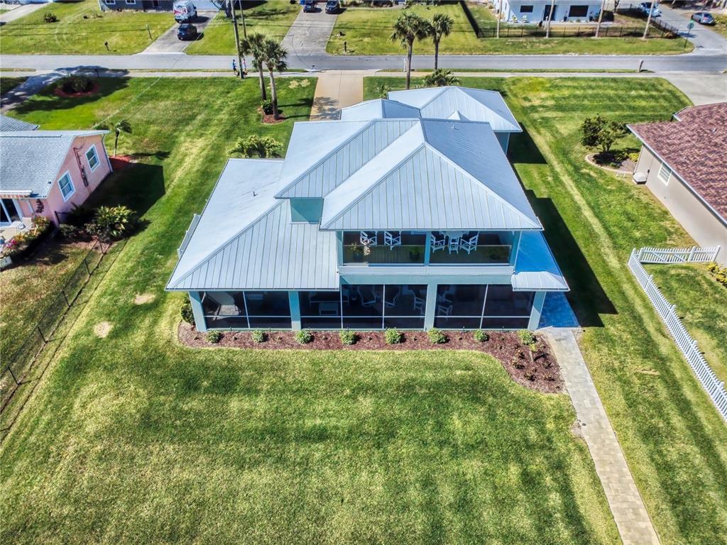 2019 South Riverside Drive Edgewater, FL 32141 - Photo 65 of 94 a aerial view of a house with a yard table and chairs