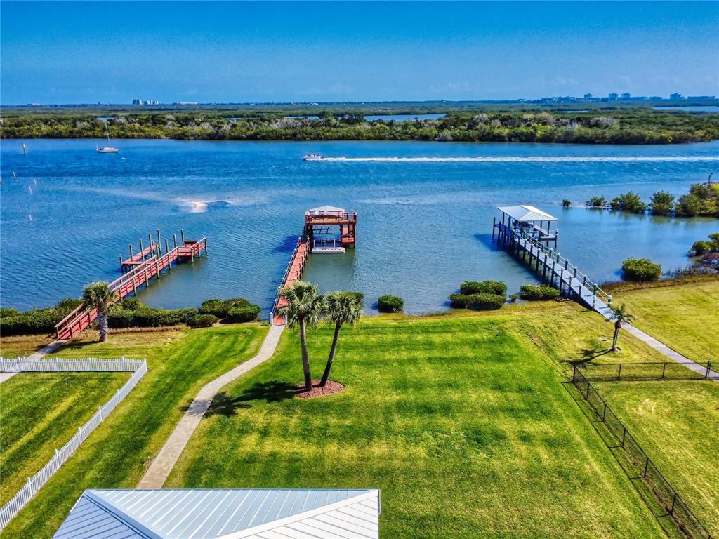 2019 South Riverside Drive Edgewater, FL 32141 - Photo 66 of 94 a view of a lake with a table and chairs