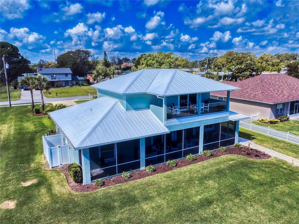 2019 South Riverside Drive Edgewater, FL 32141 - Photo 87 of 94 a view of a house with a yard porch and sitting area