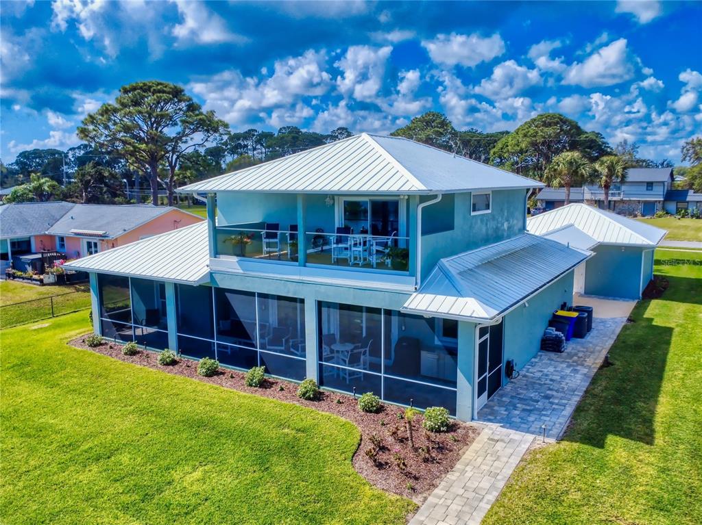 2019 South Riverside Drive Edgewater, FL 32141 - Photo 89 of 94 a front view of a house with a yard balcony
