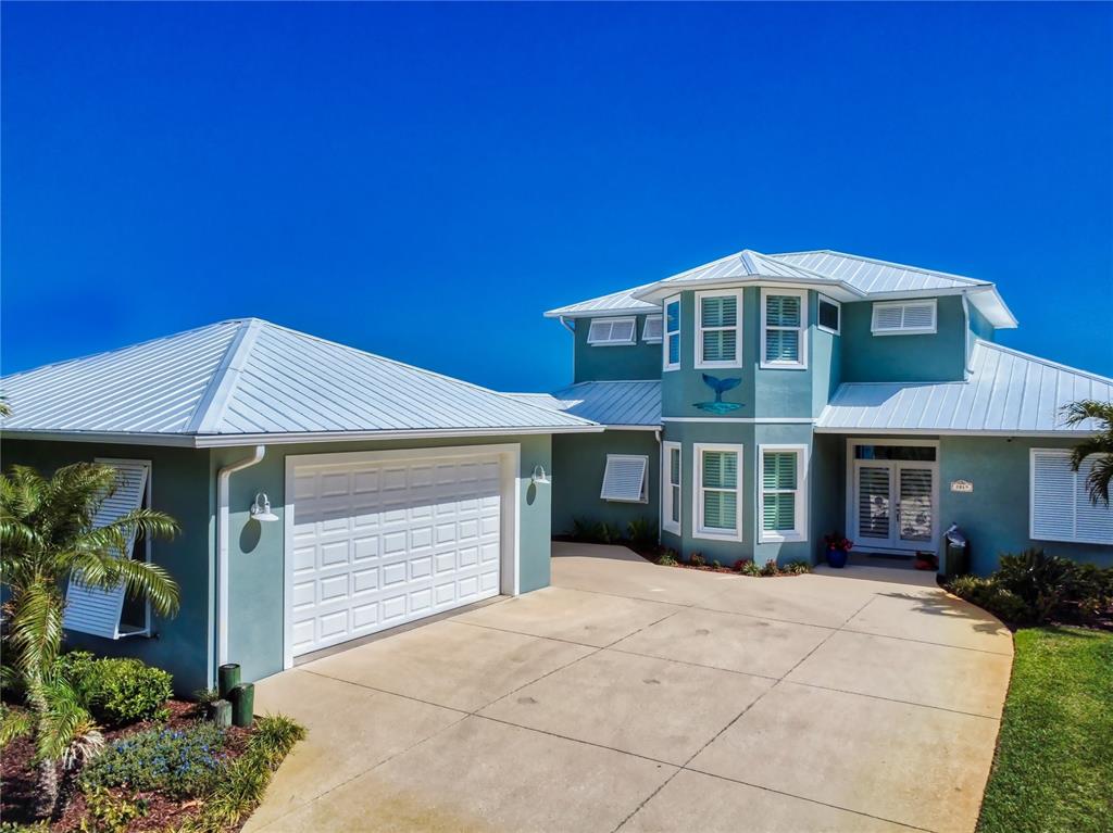 2019 South Riverside Drive Edgewater, FL 32141 - Photo 93 of 94 a front view of a house with a yard