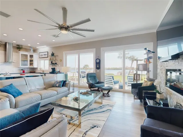 a kitchen with stainless steel appliances kitchen island granite countertop a sink and cabinets