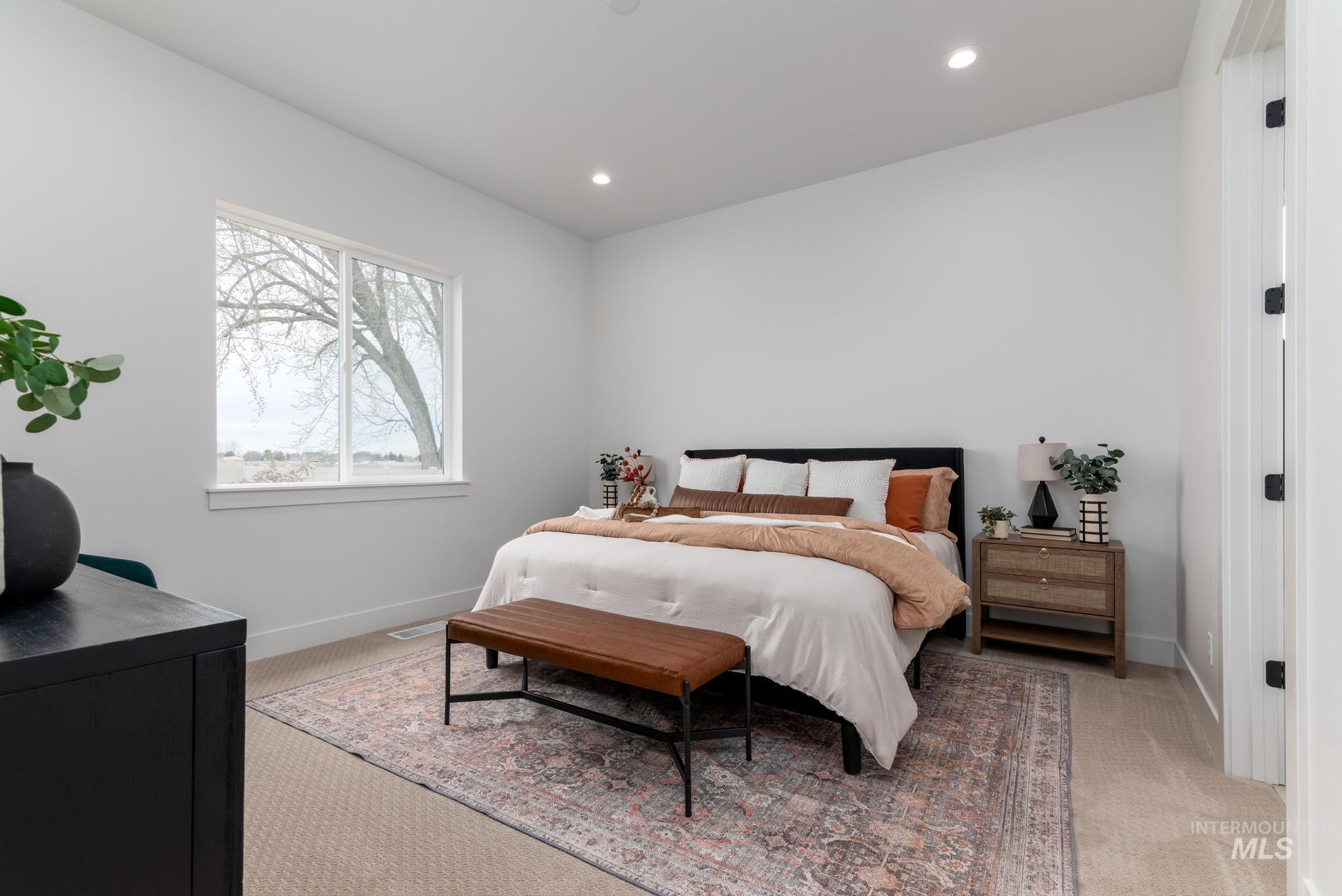 9131 West Moonglade Street Star, ID 83669 - Photo 6 of 22 Bedroom with recessed lighting and light colored carpet