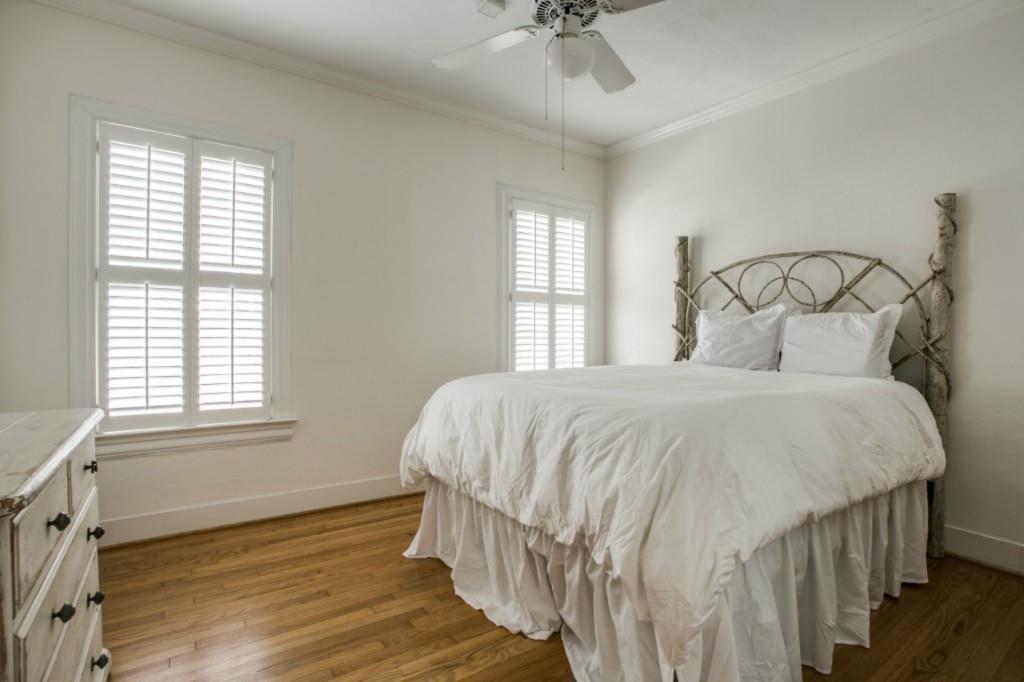 5419 Merrimac Avenue Dallas, TX 75206 - Photo 5 of 17 Bright room with wood-finish flooring, white walls, and crown molding