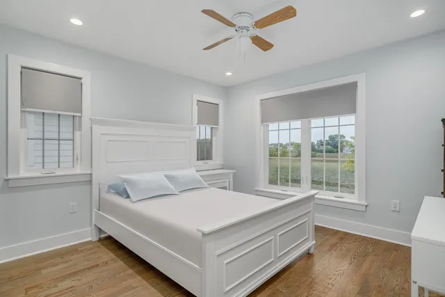 a bed room with a bed and a window