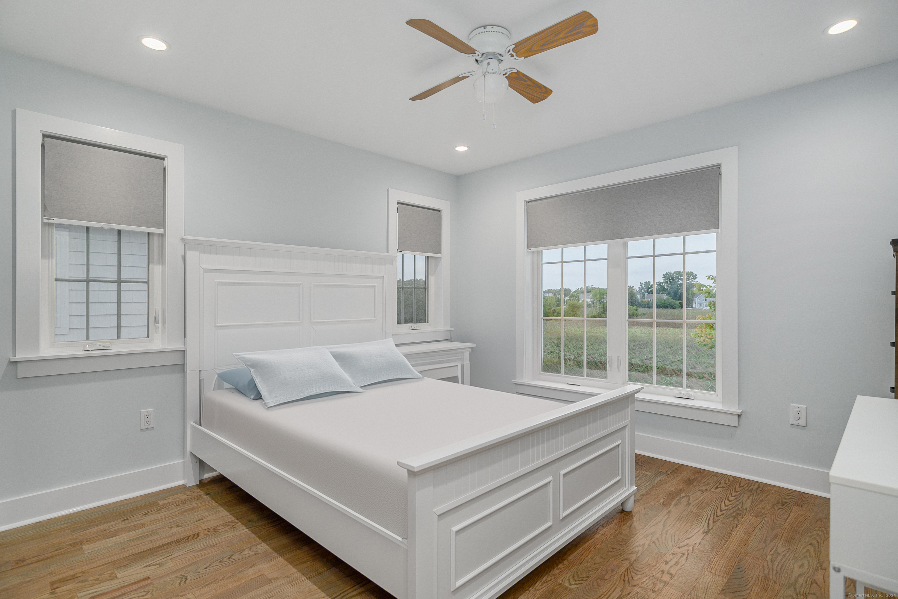 1039 Reef Road Fairfield, CT 06824 - Photo 15 of 26 a bed room with a bed and a window