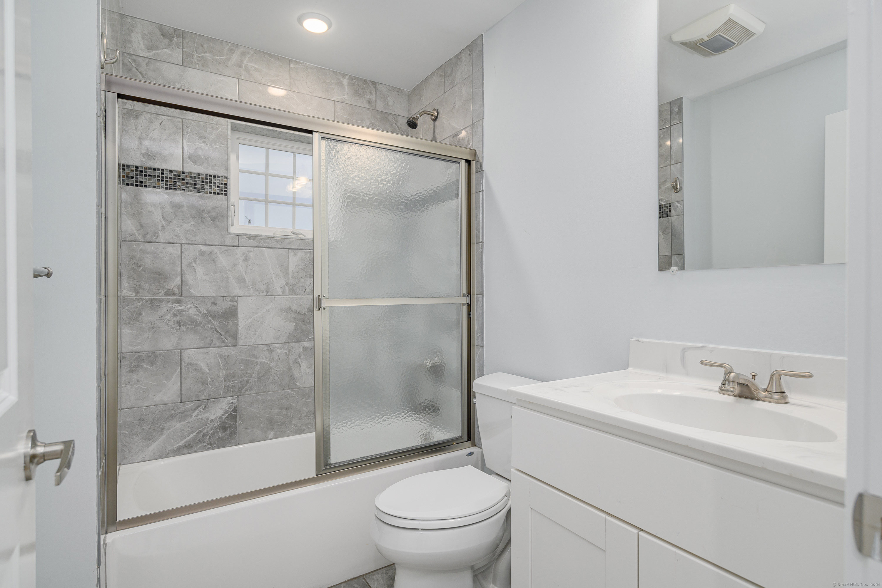 1039 Reef Road Fairfield, CT 06824 - Photo 16 of 26 a bathroom with a sink toilet and shower