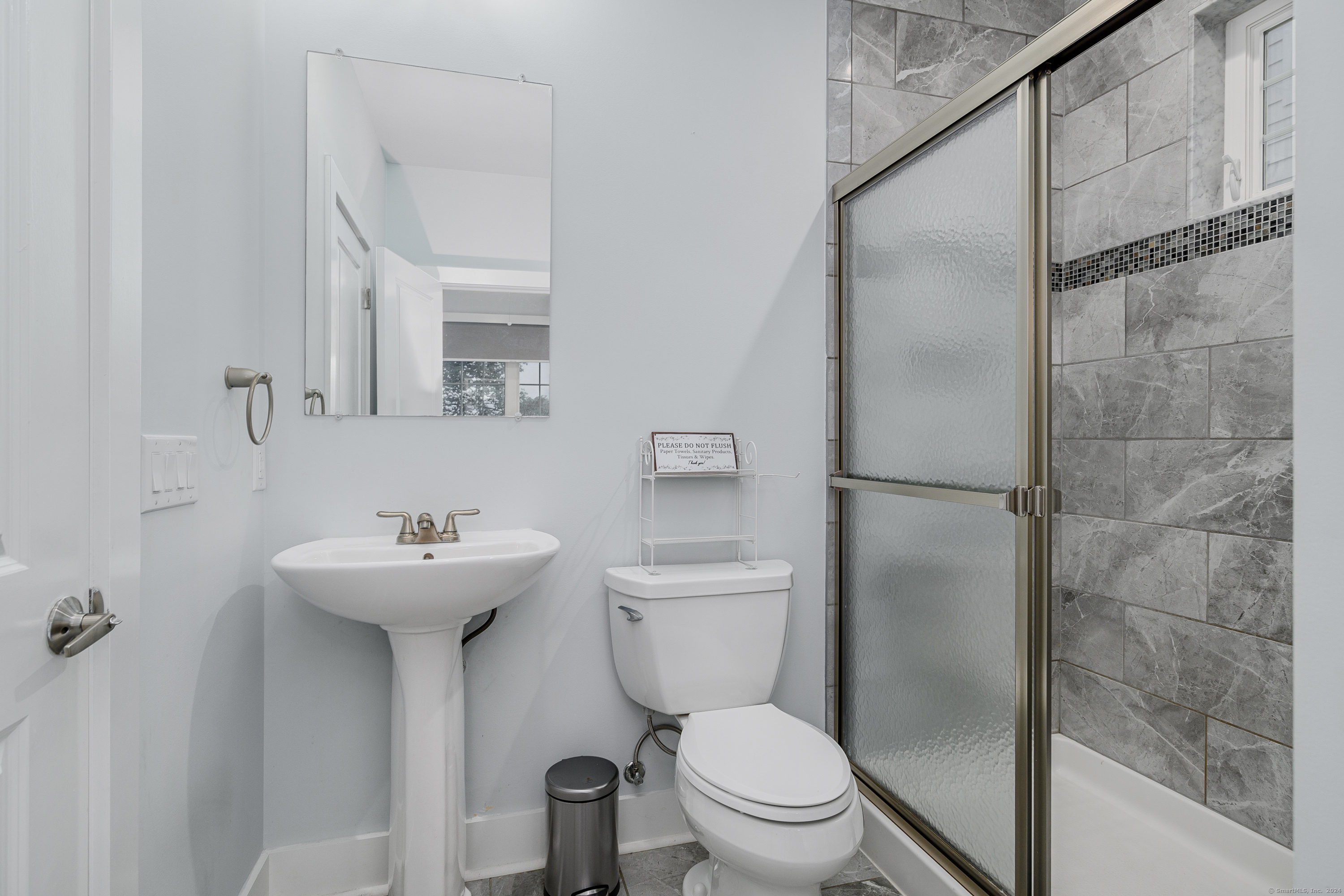 1039 Reef Road Fairfield, CT 06824 - Photo 18 of 26 a bathroom with a sink toilet and shower