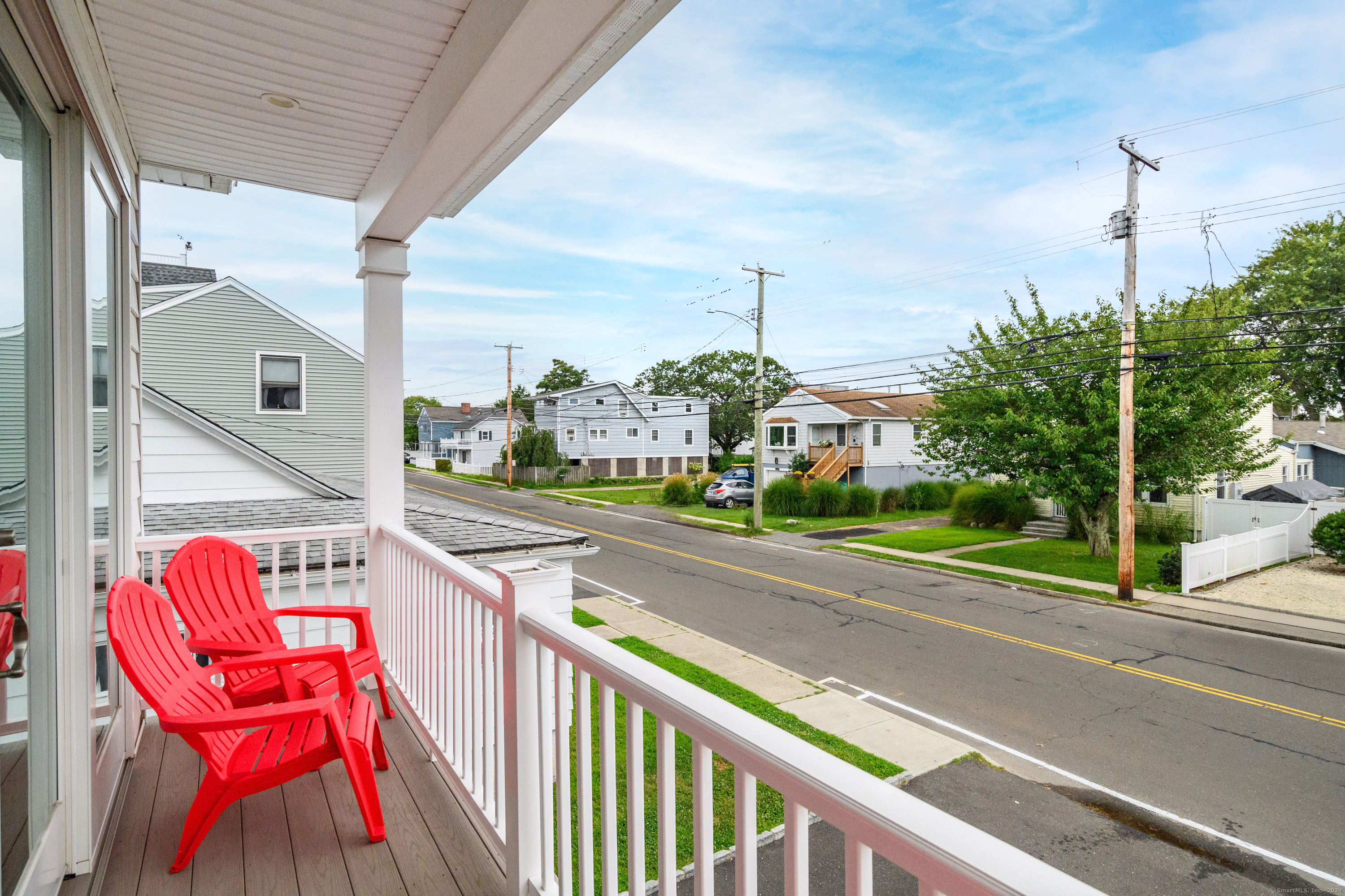 1039 Reef Road Fairfield, CT 06824 - Photo 2 of 26 a view of a street with sitting area